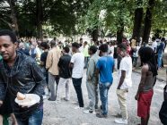 Migrants queuing in Como